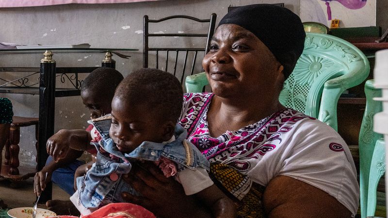 Mary Mwinqira, a patient living with diabetes, at home with her family, Dar es Salaam, Tanzania